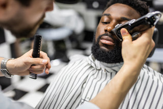 man getting beard trimmed