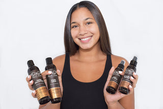 Model with soft shiny silk-pressed hair after using Rucker Roots 4 Step Silk Press System